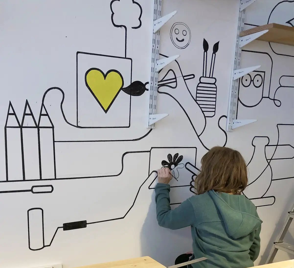 Muurschildering Madebyheroes in wording